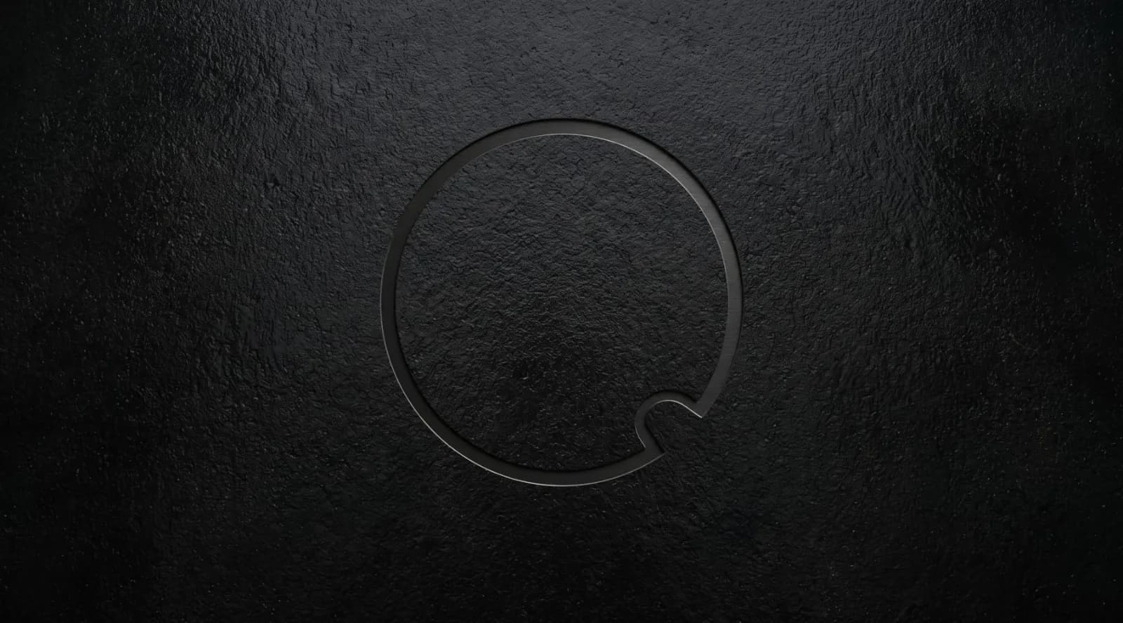 The VALDR ring cut into a black textured wall